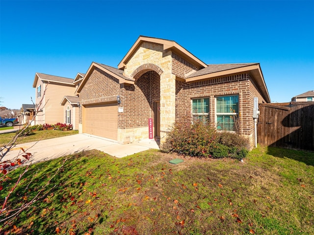 view of front facade with a front yard and a garage