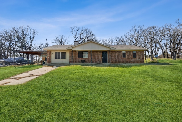 ranch-style house featuring concrete driveway, a chimney, an attached carport, a front lawn, and brick siding