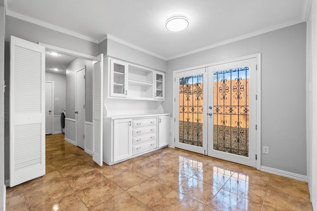 interior space featuring a textured ceiling and crown molding