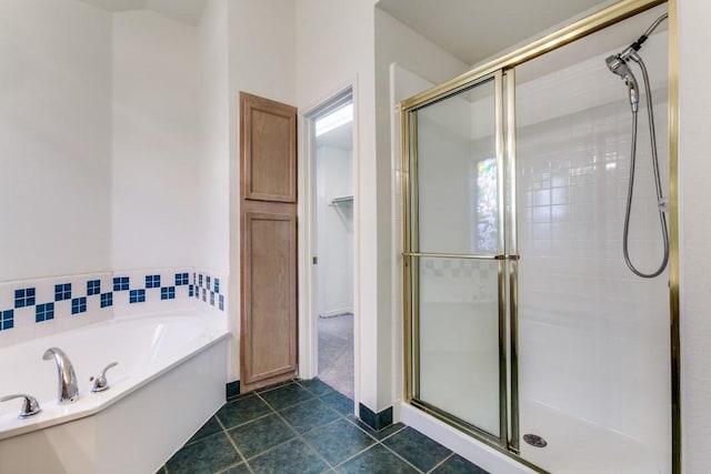 bathroom with tile patterned flooring and independent shower and bath