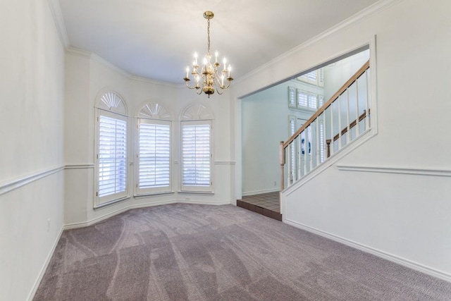 unfurnished room featuring carpet floors, a chandelier, and ornamental molding