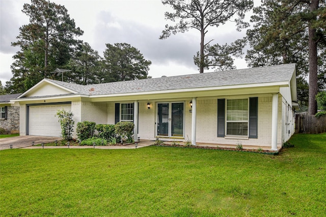 ranch-style house with a porch, a garage, and a front lawn