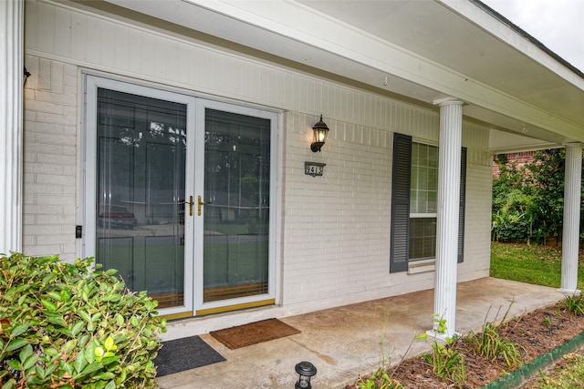 view of exterior entry featuring a porch