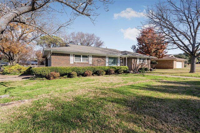 ranch-style house with a front lawn