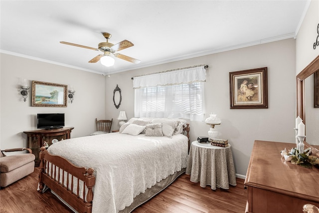 bedroom featuring ceiling fan, ornamental molding, and hardwood / wood-style flooring