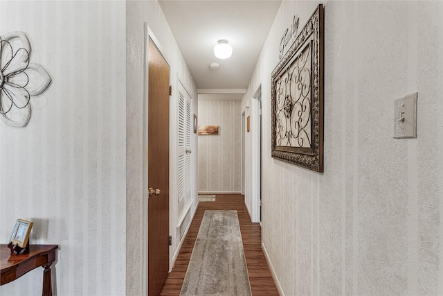 hall with dark hardwood / wood-style floors