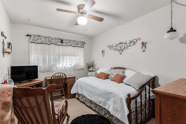 bedroom featuring ceiling fan and light carpet