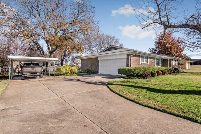 view of home's exterior with a carport, a garage, and a yard