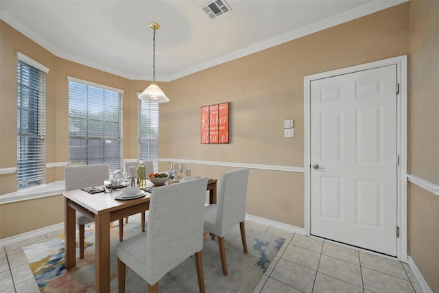 122 Wentwood Dr, Murphy, TX 75094 - dining space with light tile patterned floors and crown molding