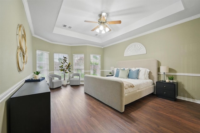 122 Wentwood Dr, Murphy, TX 75094 - bedroom with a tray ceiling, dark wood-style flooring, ceiling fan, and crown molding