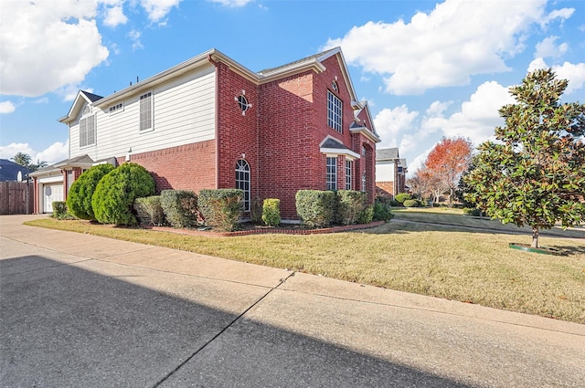 view of property exterior featuring a garage and a lawn