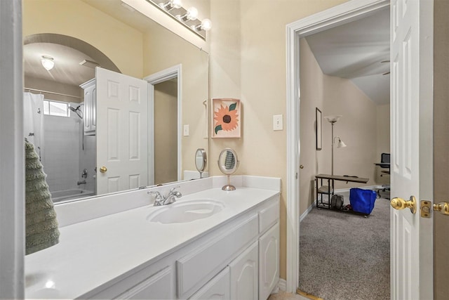 bathroom featuring shower / bath combo and vanity