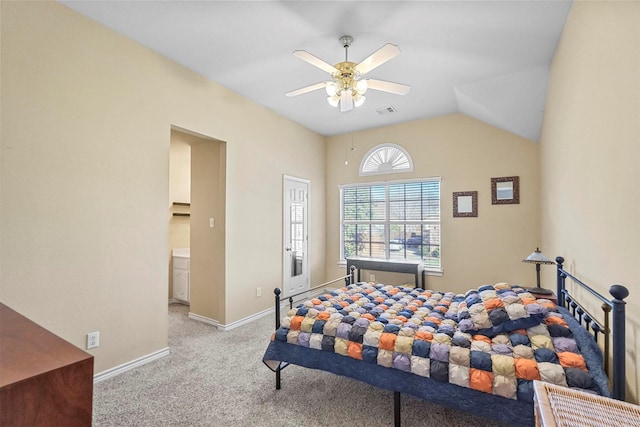 carpeted bedroom with ceiling fan and vaulted ceiling