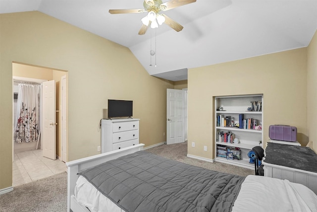 bedroom featuring light carpet, vaulted ceiling, and ceiling fan