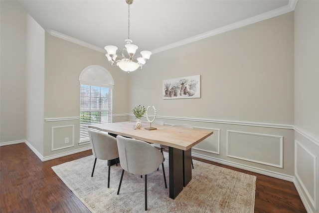 122 Wentwood Dr, Murphy, TX 75094 - dining room with ornamental molding, dark wood finished floors, a chandelier, a wainscoted wall, and a decorative wall
