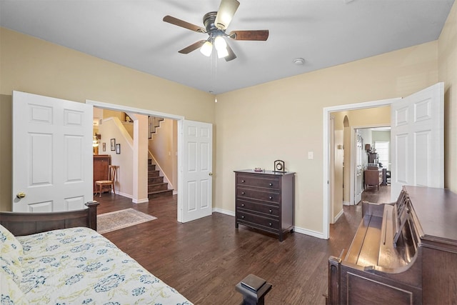 bedroom with ceiling fan and dark wood-type flooring