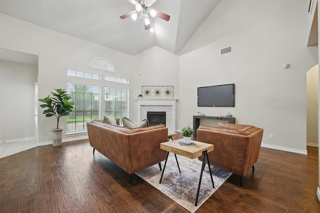 122 Wentwood Dr, Murphy, TX 75094 - living room featuring high vaulted ceiling, ceiling fan, a fireplace, and wood finished floors