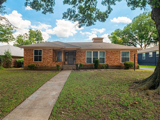 ranch-style house featuring a front lawn