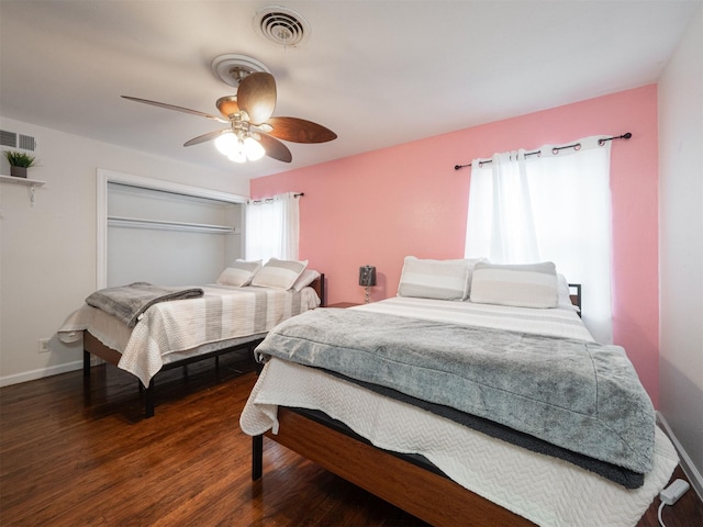 bedroom featuring ceiling fan, a closet, and dark hardwood / wood-style floors