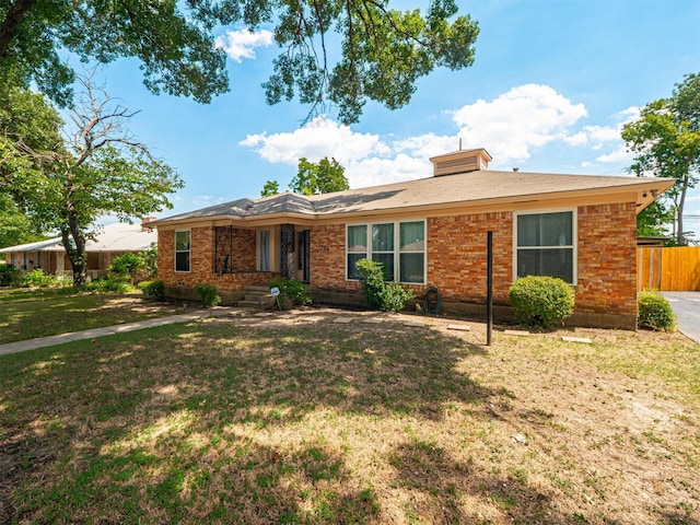 single story home with a front yard