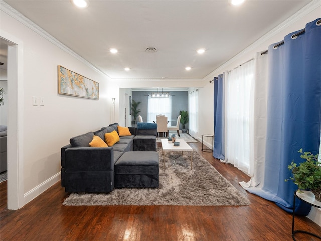 living room featuring dark hardwood / wood-style floors and ornamental molding