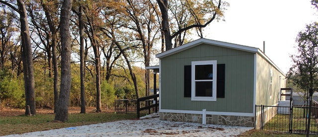 view of home's exterior featuring an outbuilding