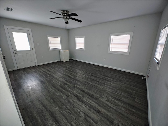 foyer with dark wood-type flooring and ceiling fan