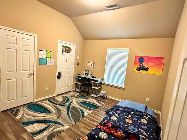 interior space featuring hardwood / wood-style flooring and lofted ceiling