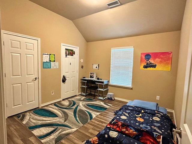 bedroom featuring vaulted ceiling