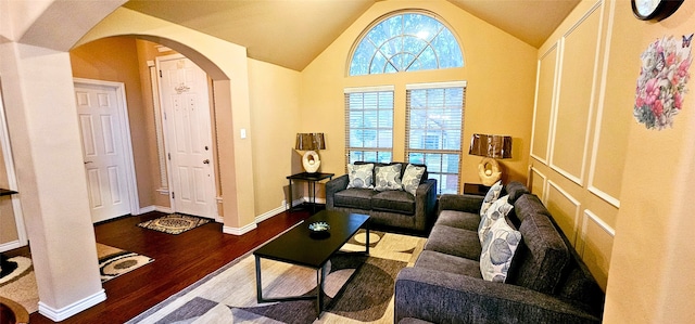 living room with hardwood / wood-style floors and vaulted ceiling