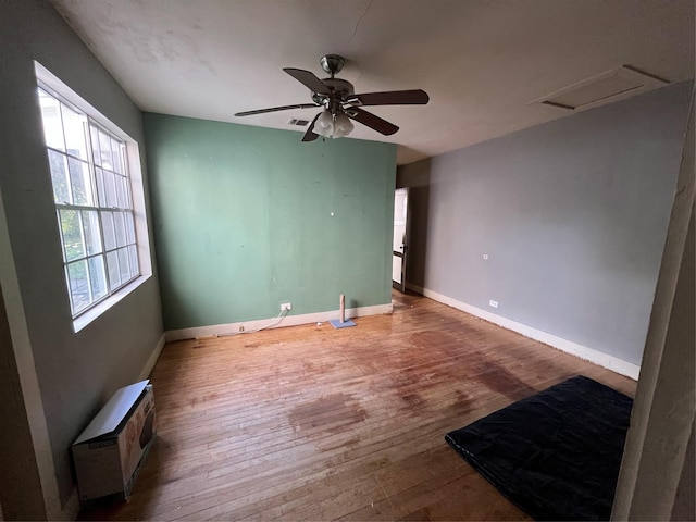 unfurnished room featuring wood-type flooring and ceiling fan