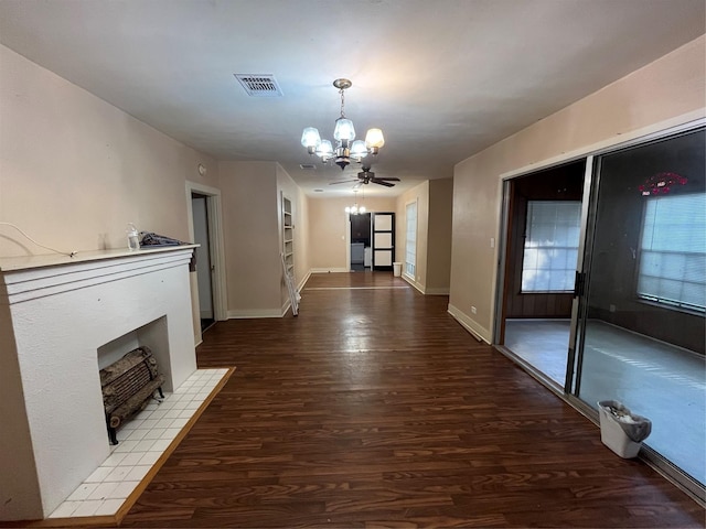 hall featuring built in shelves, wood-type flooring, and a notable chandelier