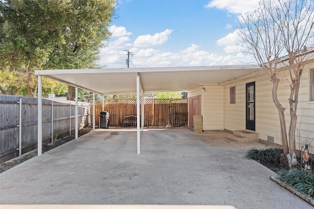 view of parking / parking lot with a carport