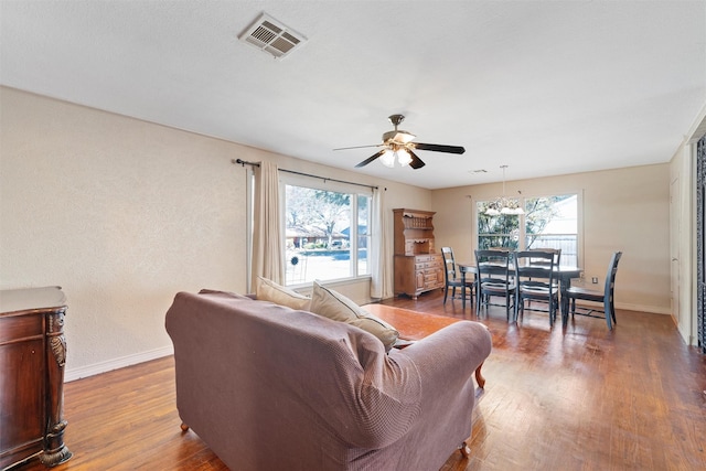 living room featuring hardwood / wood-style flooring, a wealth of natural light, and ceiling fan