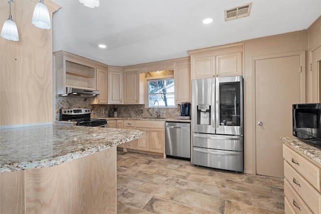 kitchen with appliances with stainless steel finishes, sink, light brown cabinets, pendant lighting, and range hood