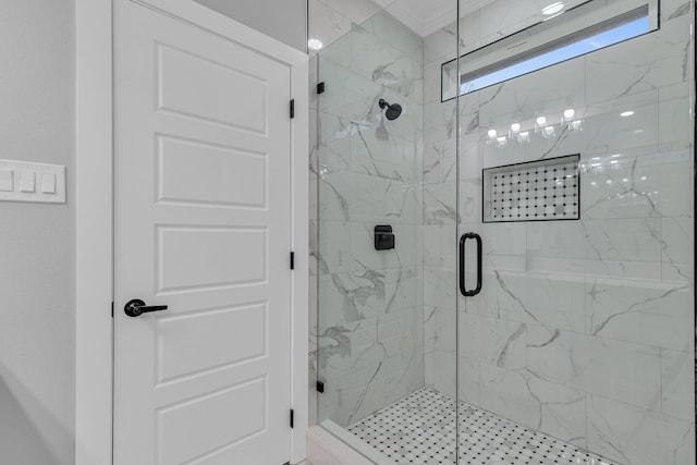 bathroom featuring walk in shower and crown molding