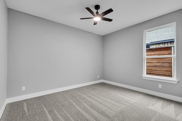 unfurnished room featuring carpet and ceiling fan