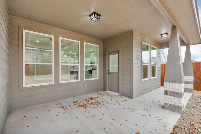 doorway to property with a patio area