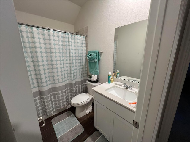 bathroom featuring wood-type flooring, vanity, and toilet