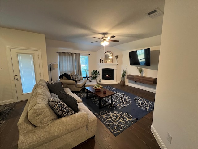 living room featuring dark hardwood / wood-style floors and ceiling fan