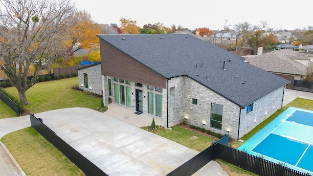 rear view of property with a patio area and a yard