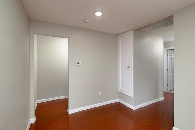 spare room with dark hardwood / wood-style flooring