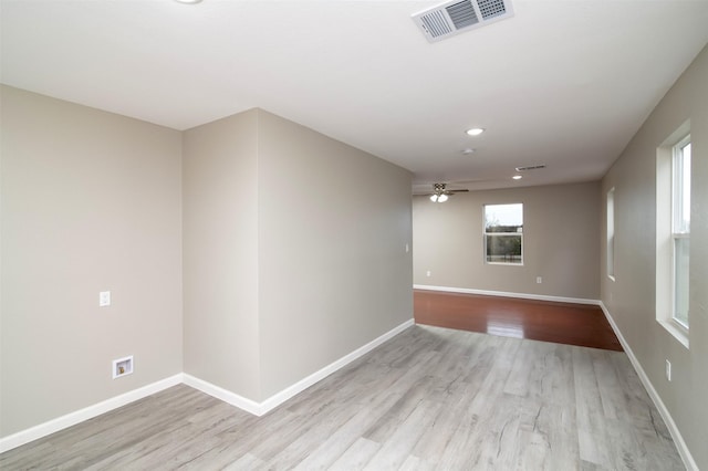 unfurnished room with light hardwood / wood-style floors