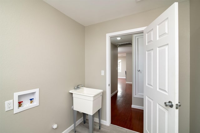 laundry room with hookup for a washing machine and wood-type flooring