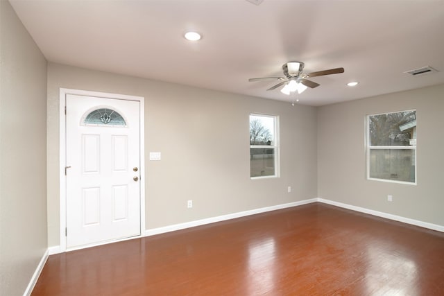 foyer with ceiling fan and dark wood-type flooring