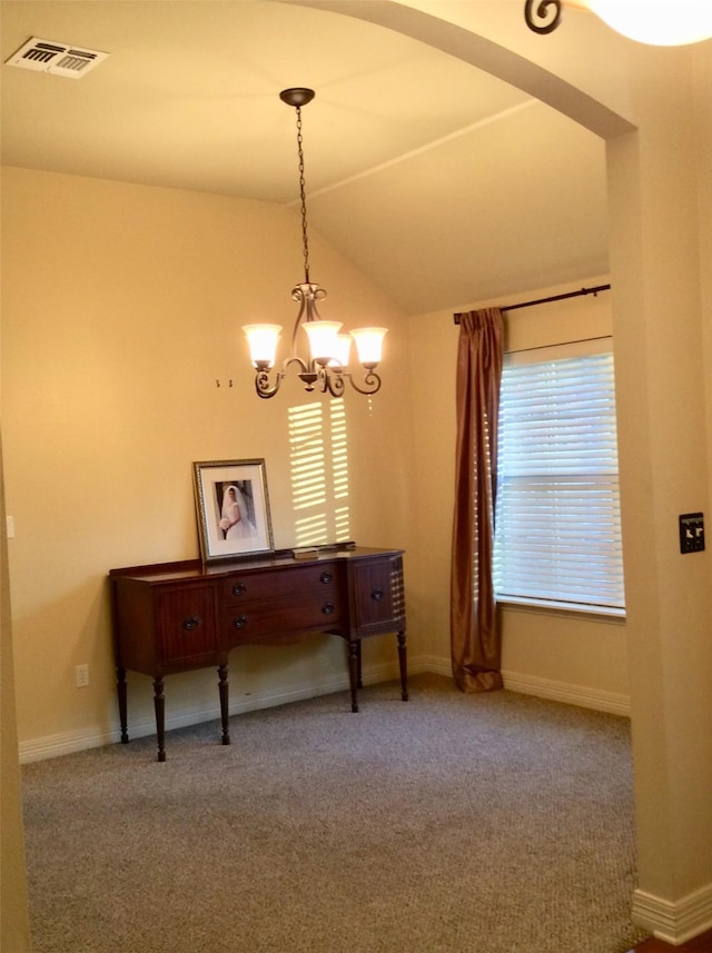 miscellaneous room featuring carpet flooring, vaulted ceiling, and a notable chandelier