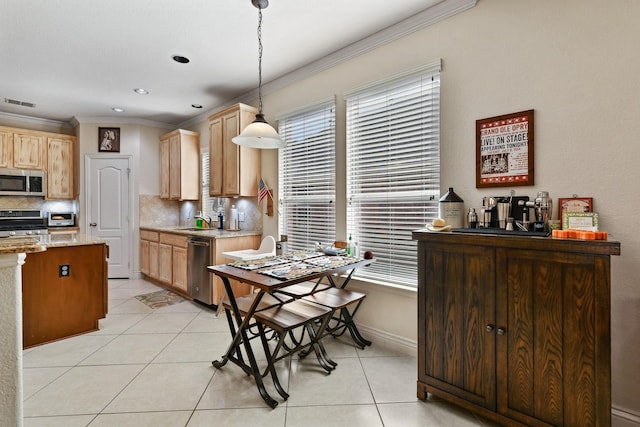 kitchen featuring sink, hanging light fixtures, decorative backsplash, light tile patterned flooring, and stainless steel appliances