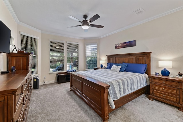 bedroom with light colored carpet, ceiling fan, and crown molding