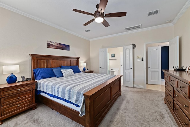 bedroom with ceiling fan, ornamental molding, light carpet, and connected bathroom