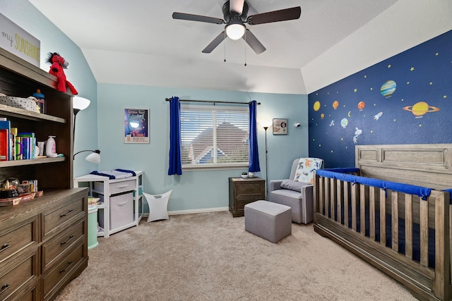 bedroom with ceiling fan, lofted ceiling, and light carpet